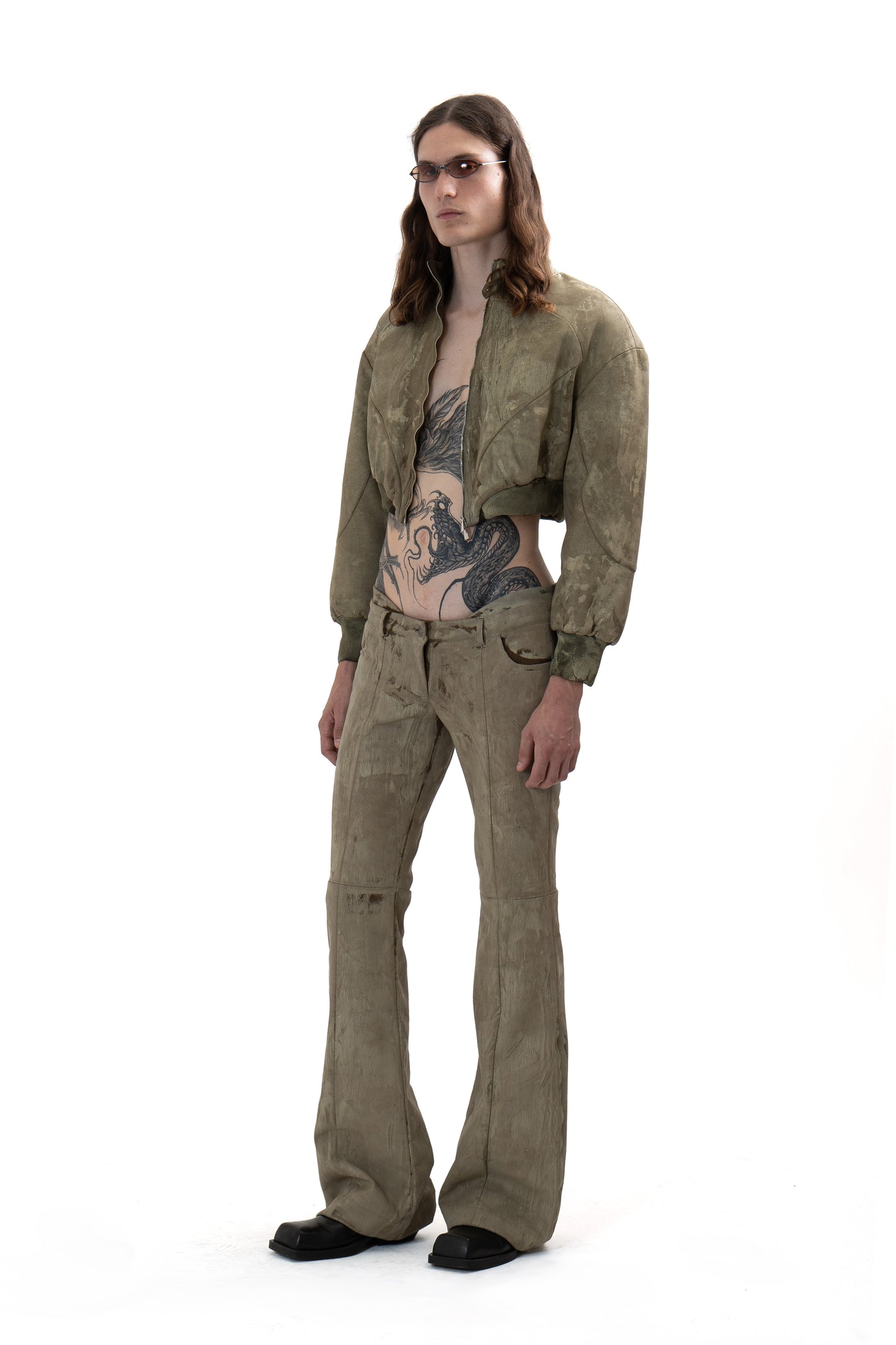 Low-waisted CRACKED effect trousers