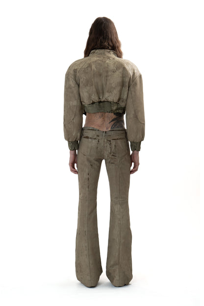 Low-waisted CRACKED effect trousers