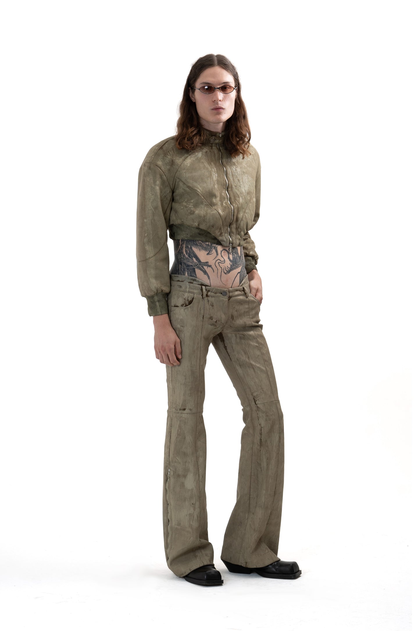 Low-waisted CRACKED effect trousers